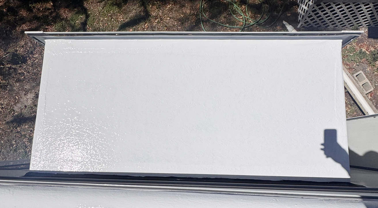 RV slide-out sealed with silicone after maintenance and coating application