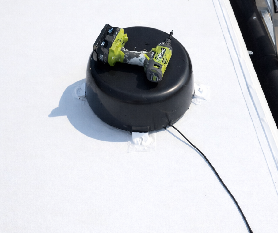 Roof antenna sealed on new TPO membrane after replacement