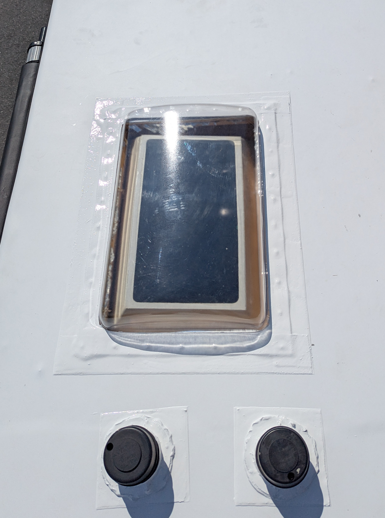 Newly sealed RV skylight after TPO roof replacement