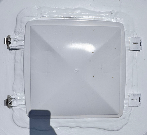 Roof vent sealed with clean finished sealant after repair