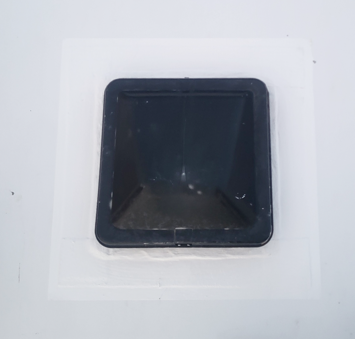 Newly sealed roof vent on TPO membrane after RV roof replacement