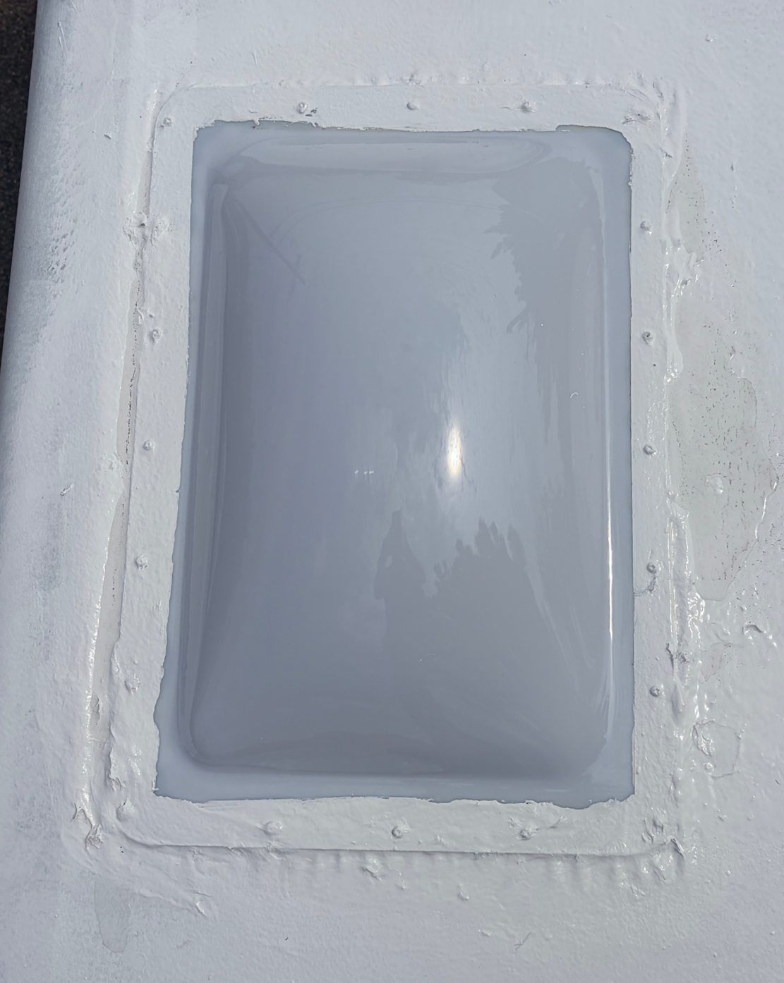 Skylight sealed after roof repair