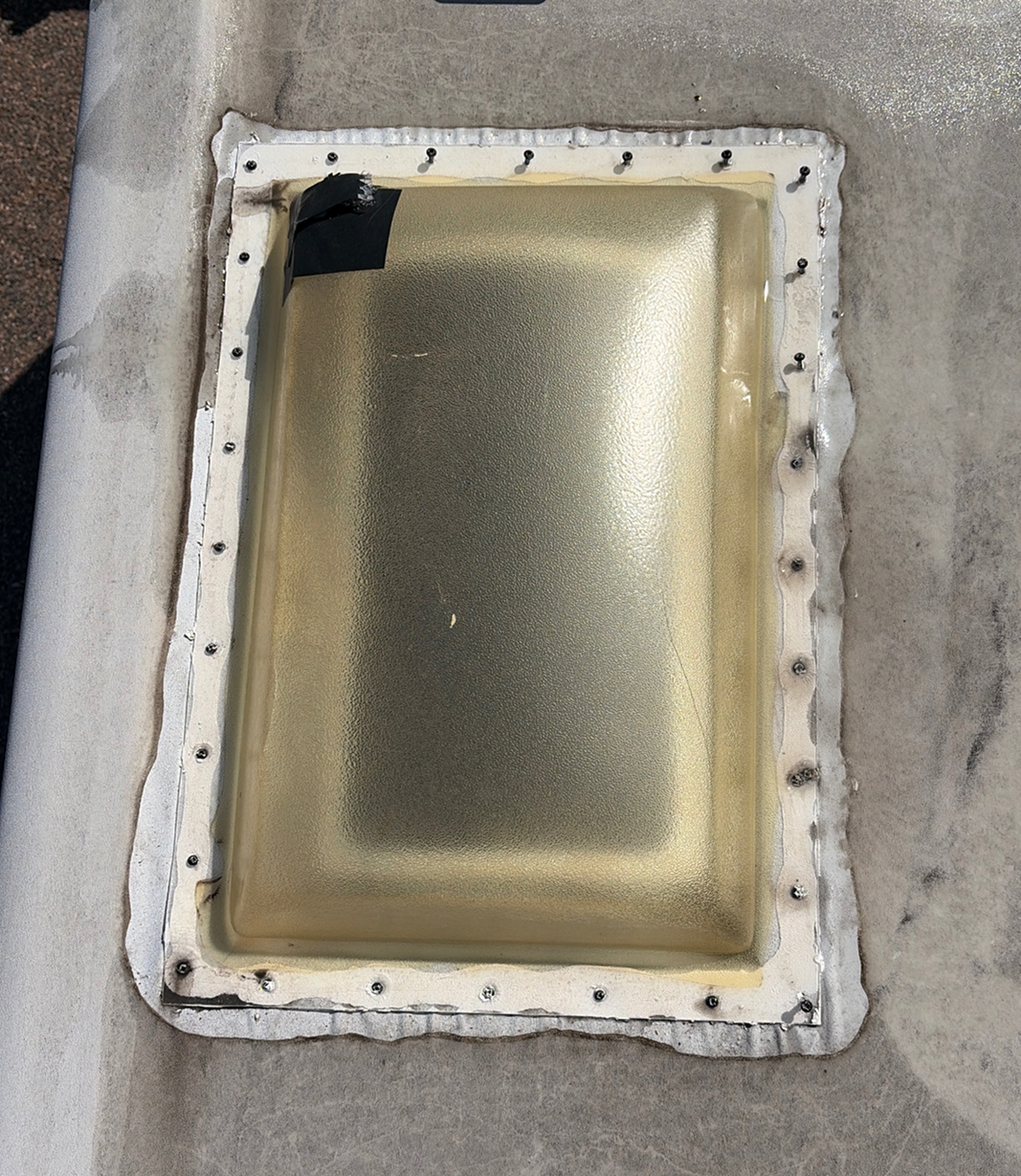 Cracked skylight before roof repair