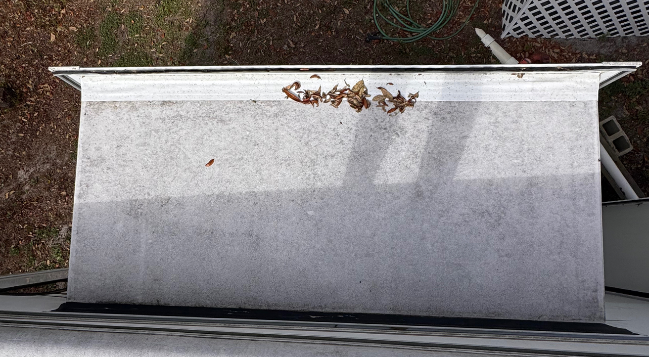 Worn RV slide-out before silicone sealing and protection