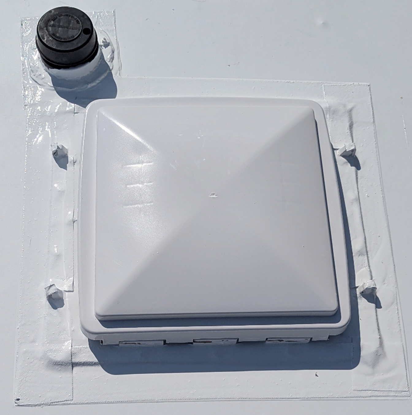 New sealed roof vent installed on TPO membrane after replacement