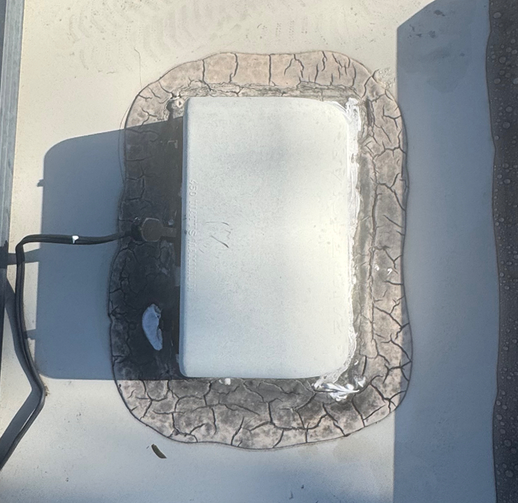 Old sealant around solar wiring