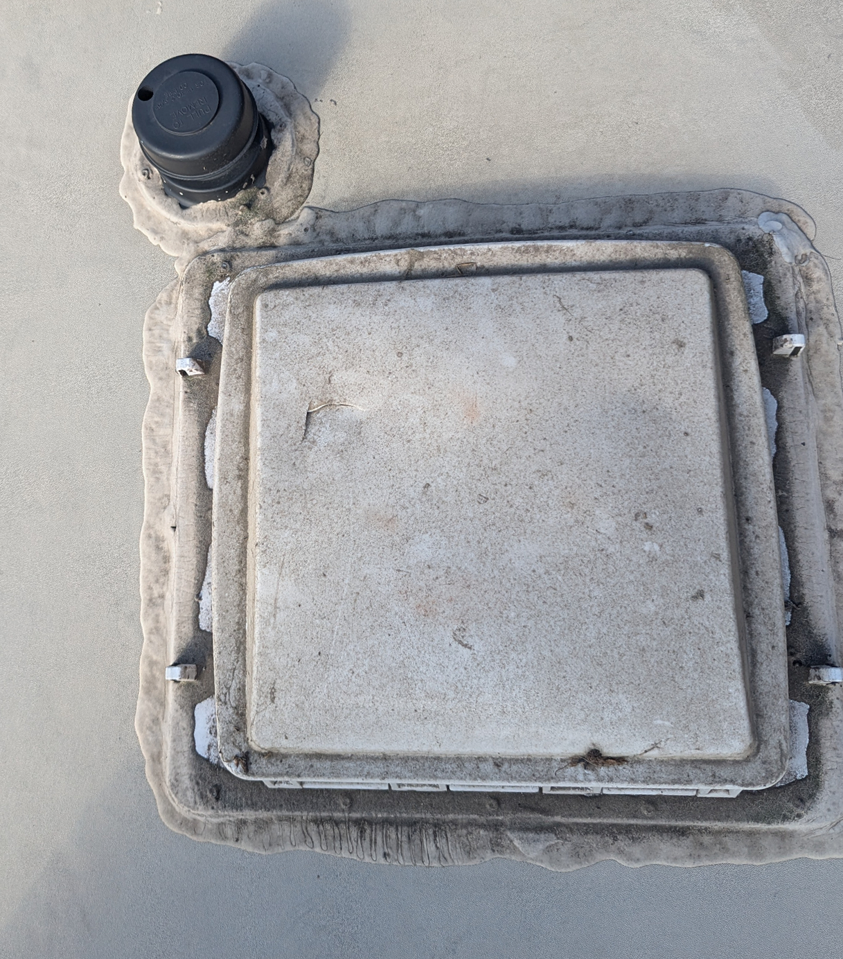 Damaged roof vent on RV before replacement