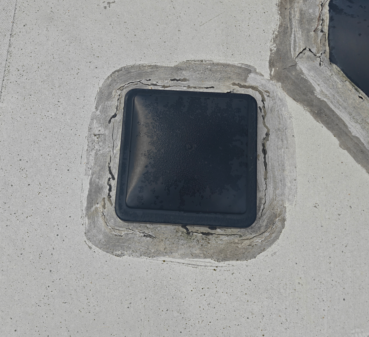 Worn anWorn and cracked sealant around roof vent on RV before maintenanced cracked sealant around roof vent on RV before maintenance